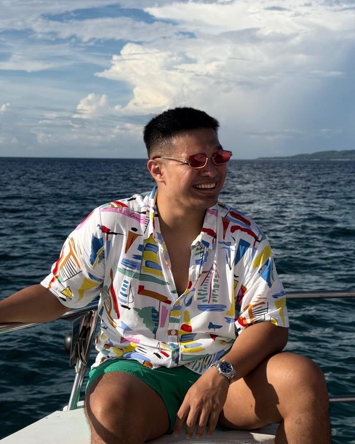 Arvin De las Alas smiling on a boat at sea
